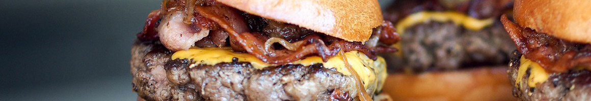 Eating American (Traditional) Burger at Islands Restaurant Corona restaurant in Corona, CA.
